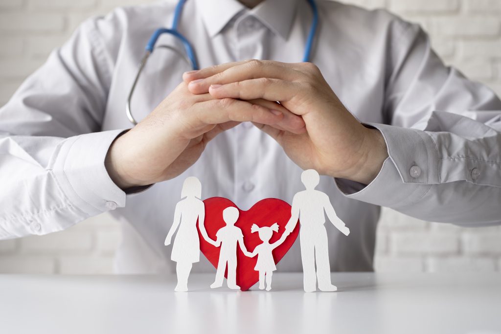 a health specialist protecting whole family a health insurance representation image
